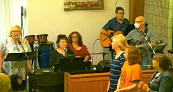 Band and part of Choir with Barbara Leader of Song, Lindsey Piano, Sue Djembe, Ray Guitar, Brian Guitar,